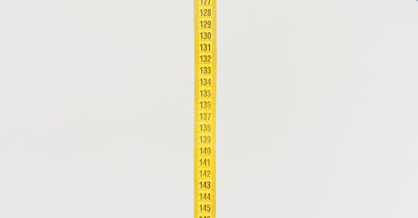 Manual Testing - Woman showing measuring tape for checking body forms