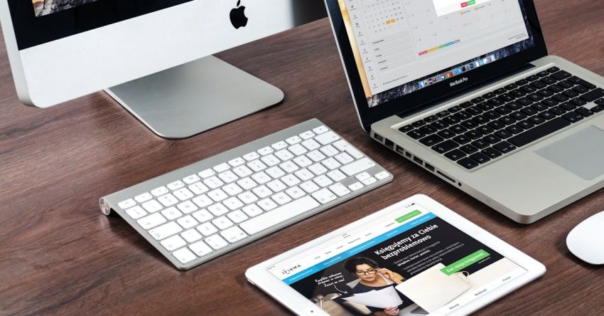 Web Application - Turned on Imac Beside Macbook on Table