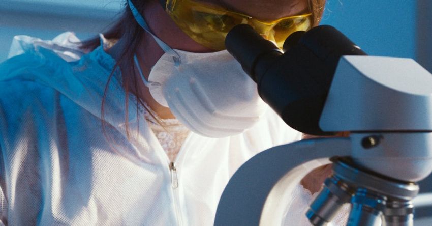 Automated Testing - Photo Of Woman Looking Through Microscope